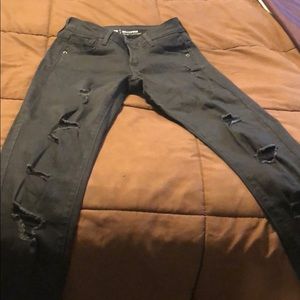 Ripped mid rise black washed jeans